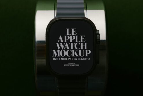 Black Apple Watch with dark band displaying serif typography mockup on green backdrop