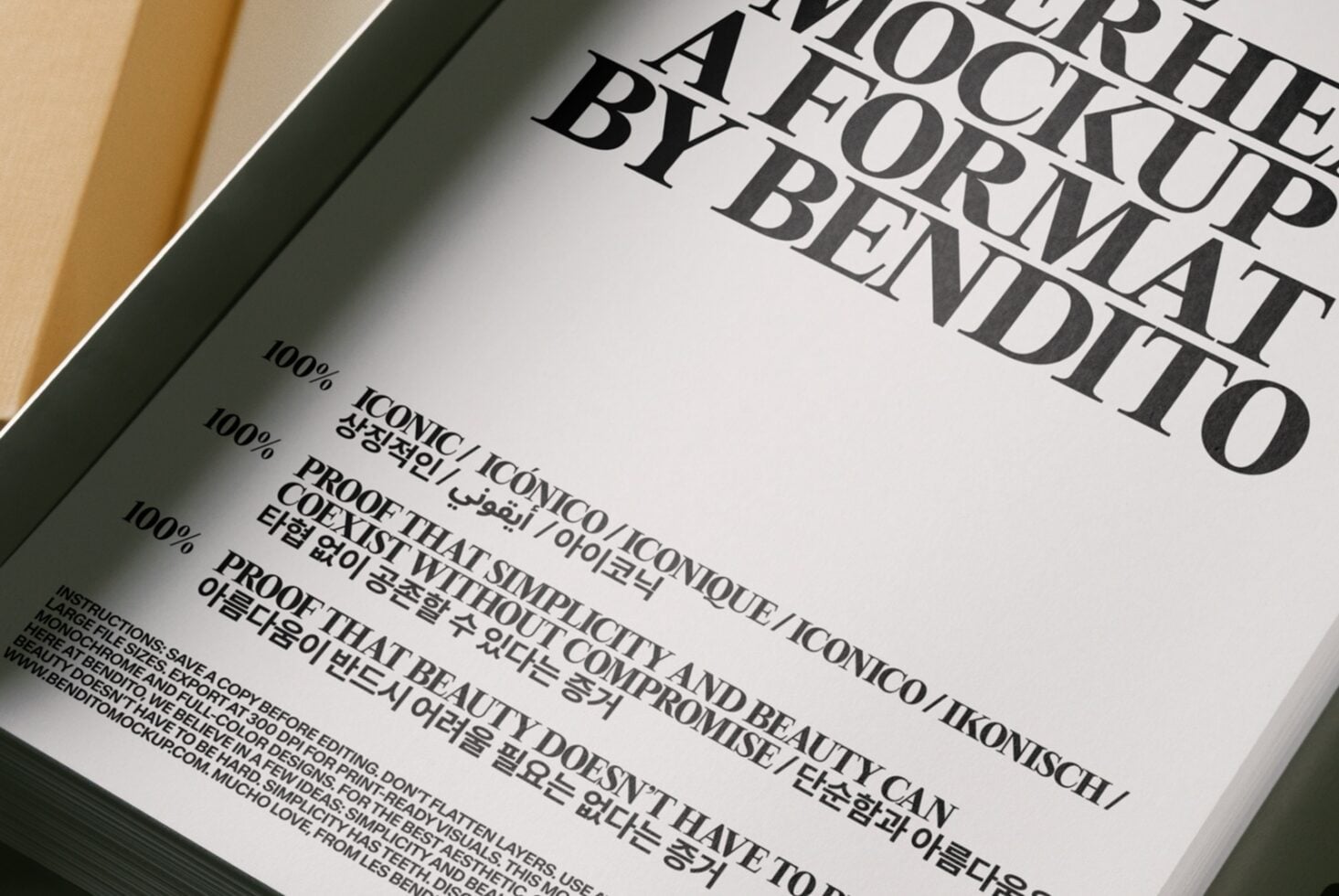 Book cover mockup shot overhead showing serif typography with multilingual text on cream paper in olive green frame