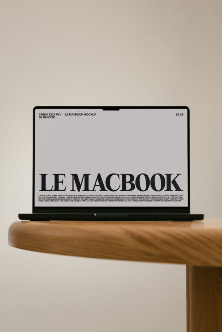 MacBook Pro mockup on wooden table with beige background showing screen display