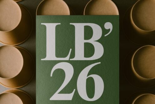 Green card mockup with serif typography surrounded by natural wood bowls