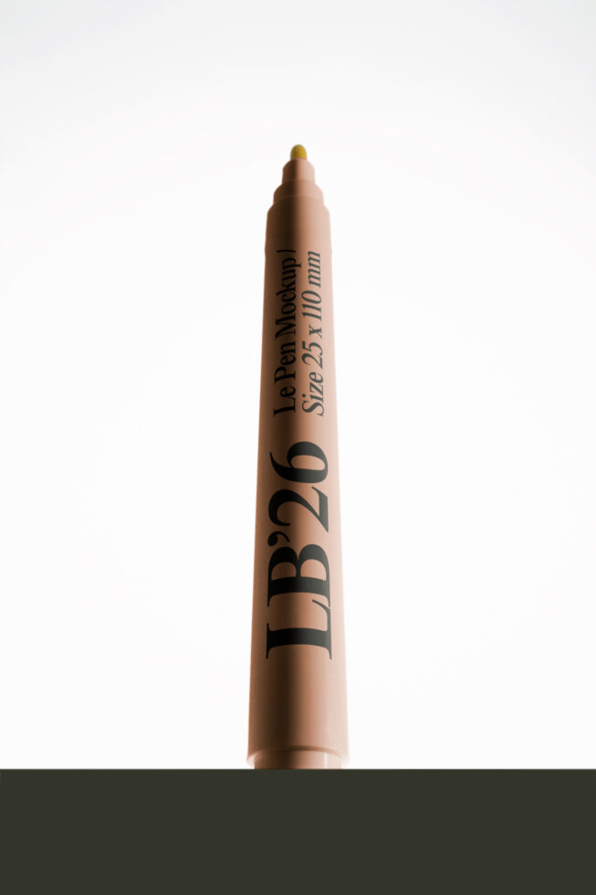 Marker pen mockup with customizable text on beige barrel, gold cap, clean white background