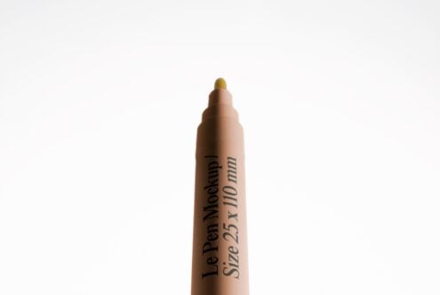 Le Pen Mockup with gold tip on clean white background, centered shot