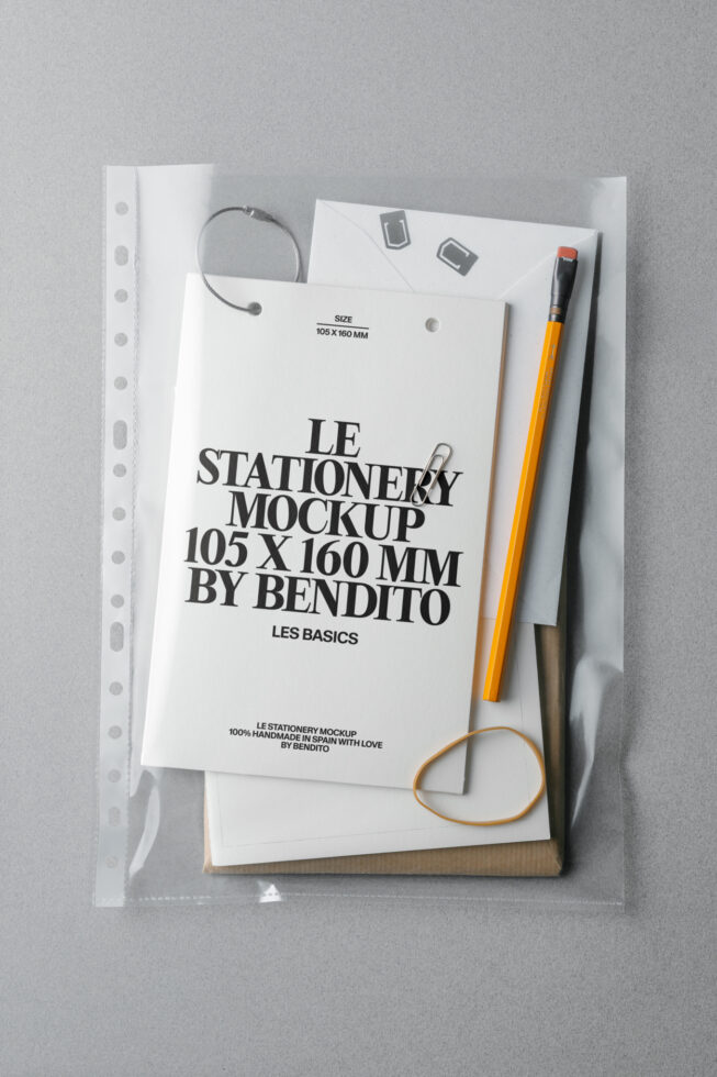 Flat lay of stationery mockup with papers, pencils, headphones, rubber bands in clear sleeve