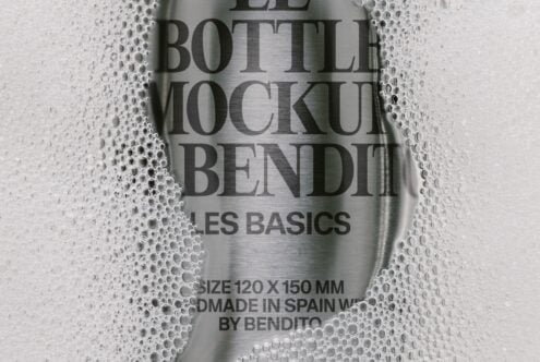 Metallic bottle mockup wrapped in bubble wrap showing product label with condensation effect