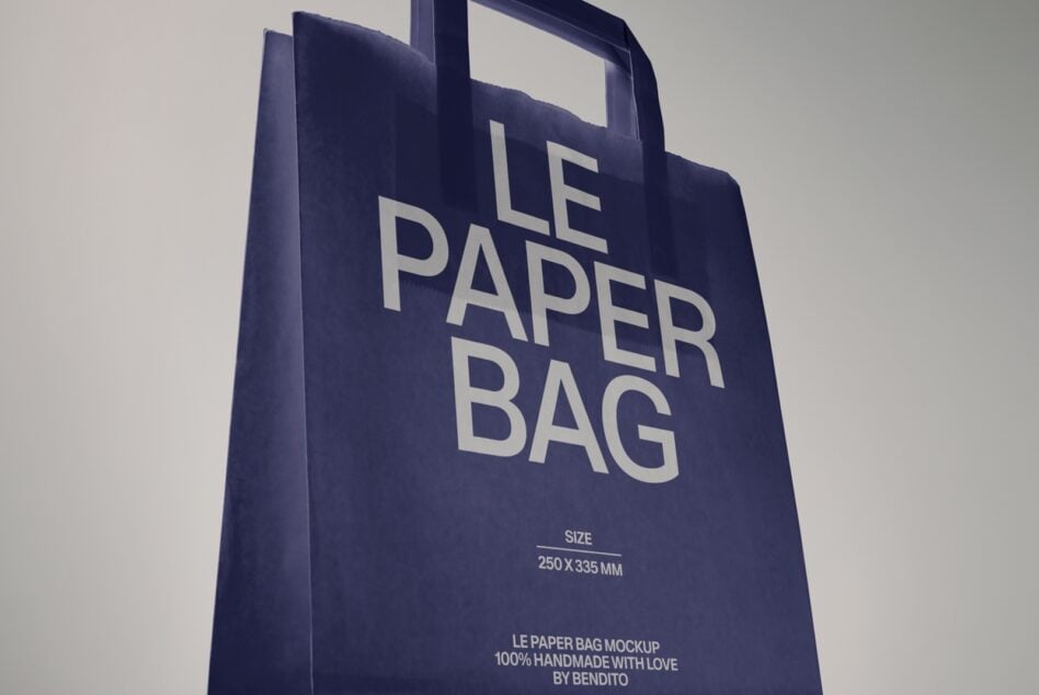 Navy paper bag mockup with handle, showing front view with editable text space on clean minimalist background