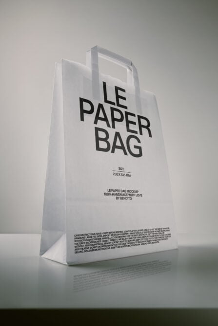 White paper bag mockup with bold black typography showing size dimensions, crafted by Bendito