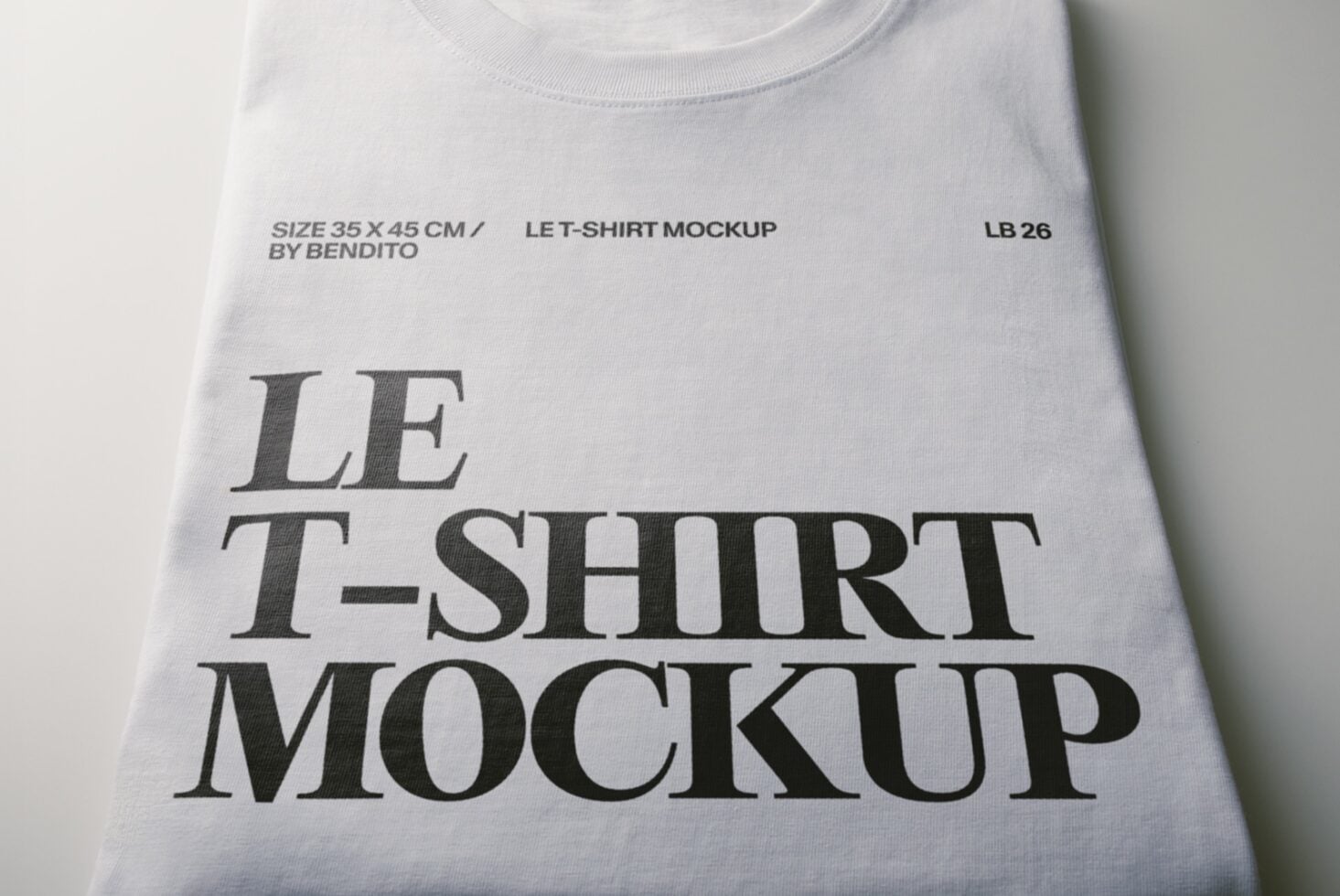 Flat lay of white tee with serif typography mockup showing print placement on cotton fabric