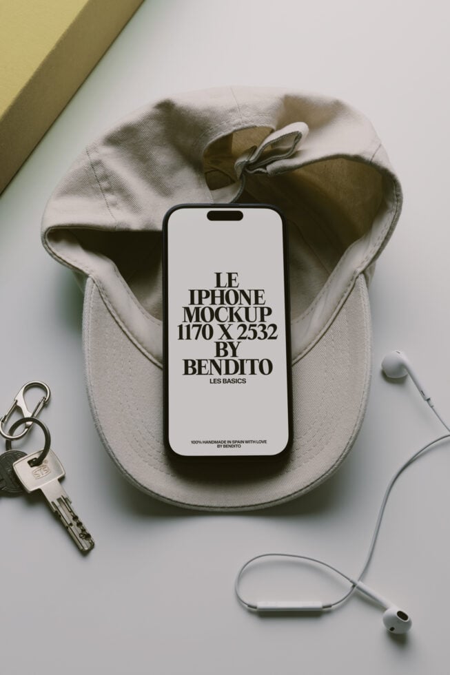 iPhone mockup on cream pouch with keys, earbuds, minimal aesthetic styled flat lay