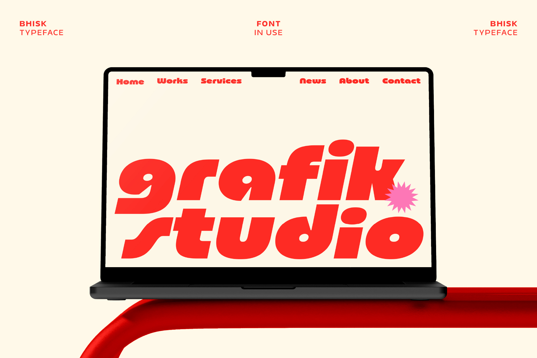 Laptop showing Bhisk typeface in bold red on a website homepage with navigation menu