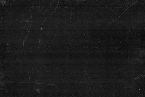 Dark marble texture with subtle veining, grainy surface finish across grid panels