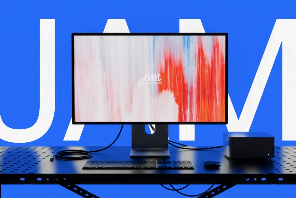Desktop setup mockup with monitor displaying red gradient texture, keyboard, mouse on blue background
