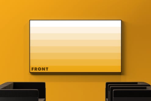 Horizontal poster mockup with gradient fill from cream to gold, black frame on mustard yellow wall