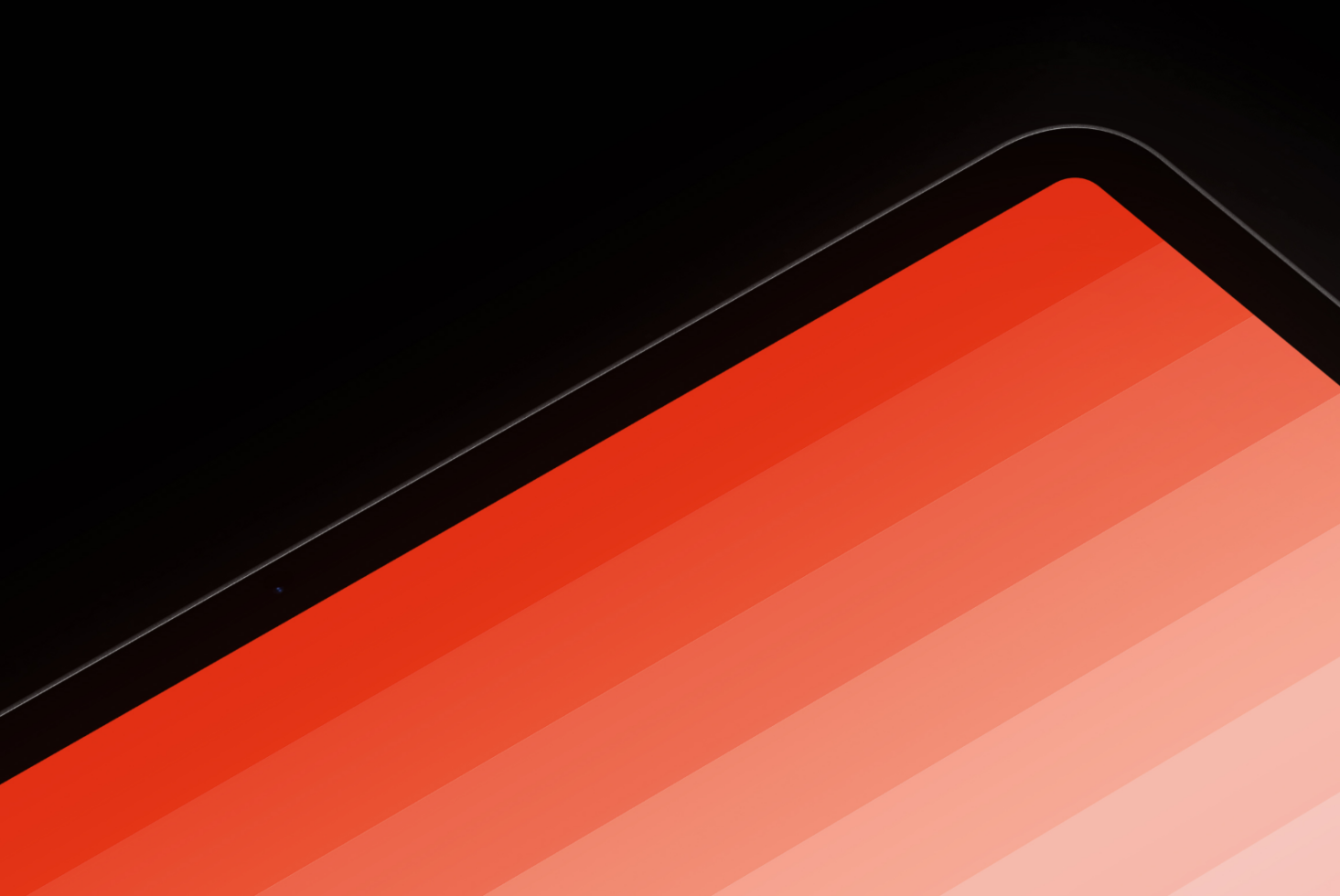 Laptop screen mockup showing vibrant red to blush gradient stripes on black background