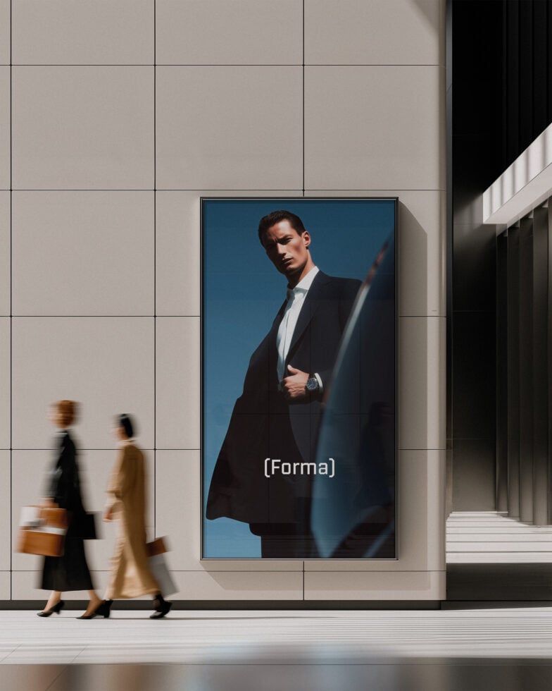 Digital billboard mockup showing man in black suit on teal background in modern building lobby
