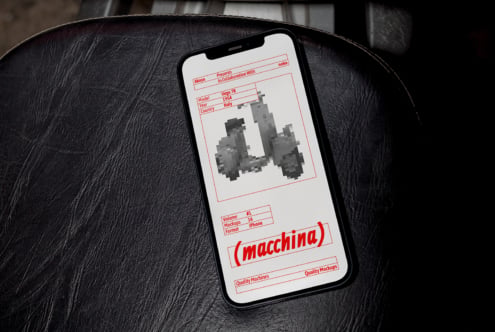 iPhone mockup displaying vintage Vespa scooter with red border design on black leather surface