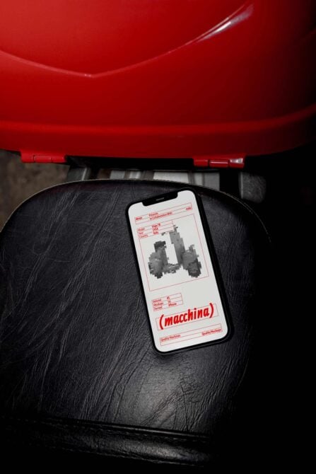 iPhone mockup on black leather with red industrial backdrop, showing retro tech label design