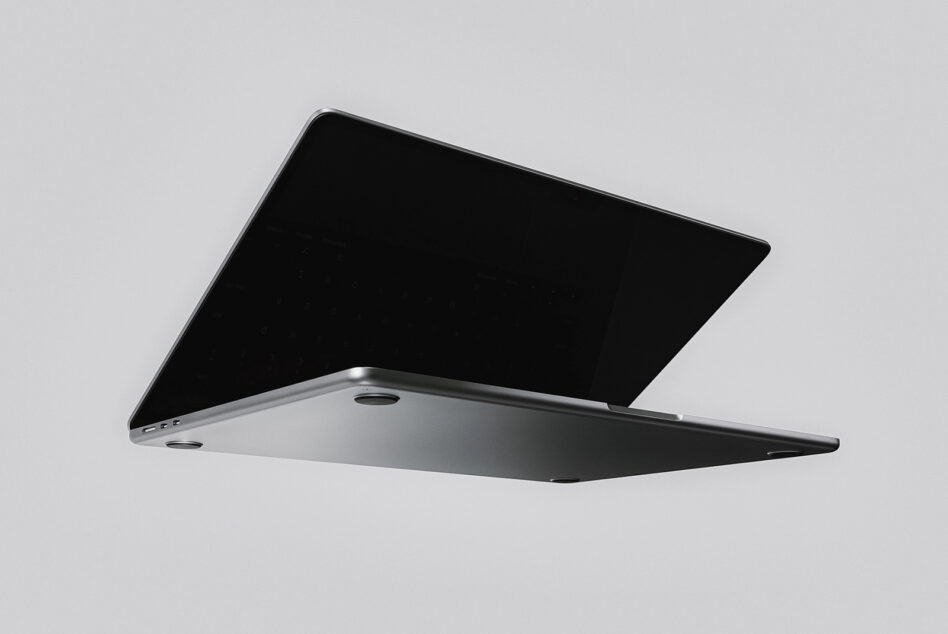 Sleek laptop mockup with open lid showing black screen on light gray background