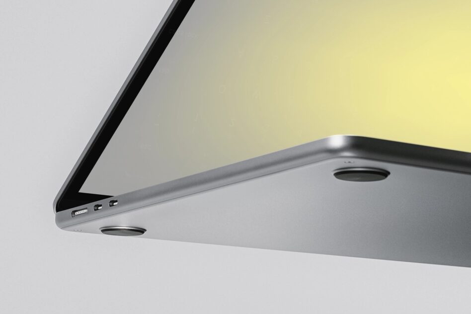 Sleek silver laptop mockup tilted at angle with yellow gradient background