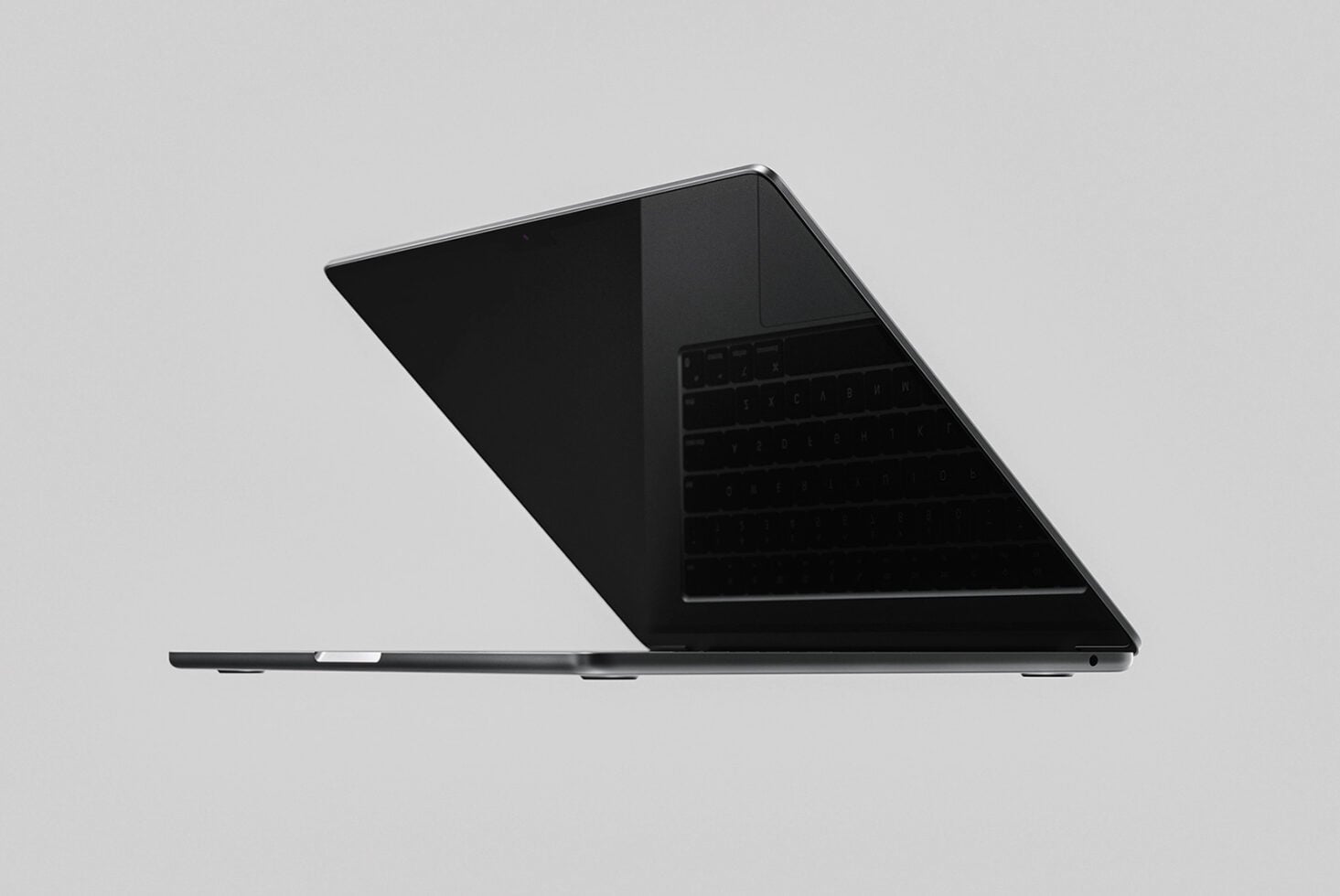 Sleek black laptop mockup angled side view with dark screen on neutral background