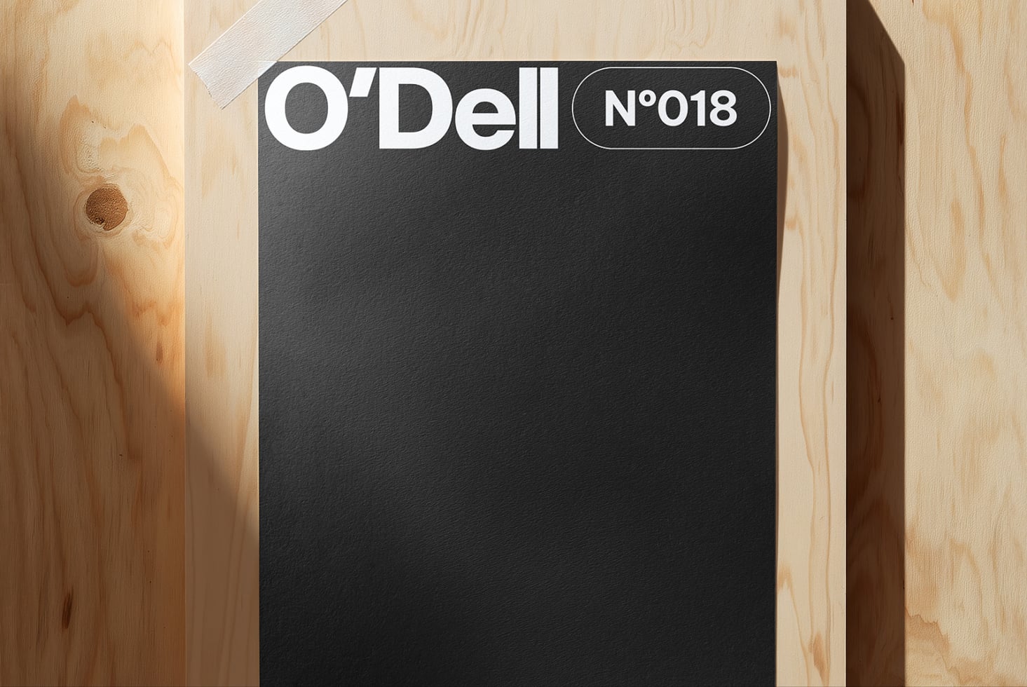 O'Dell N°018 black business card mockup on natural wood surface