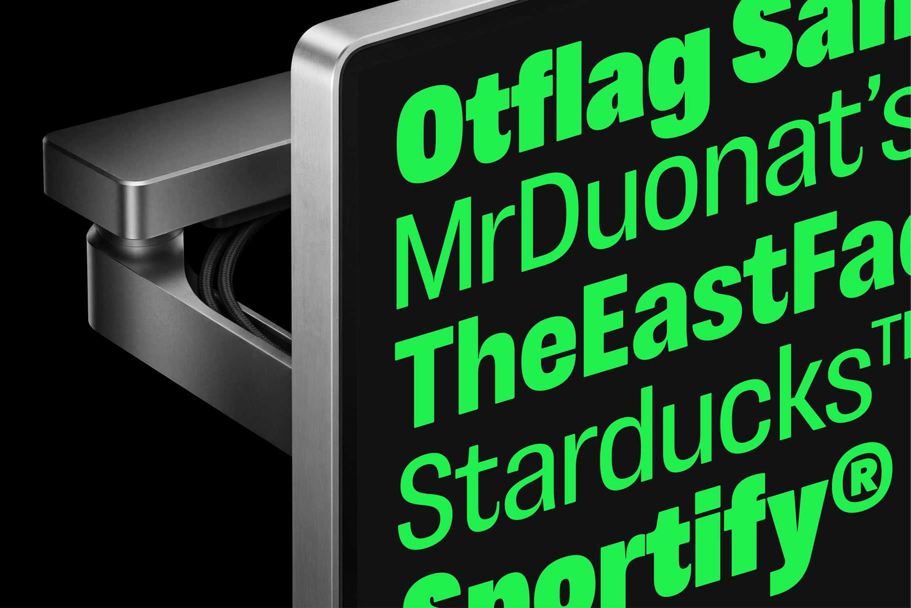 Metallic box mockup with neon green text on black label showing brand names