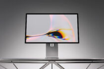 Desktop monitor mockup with vibrant chromatic aberration effect on display