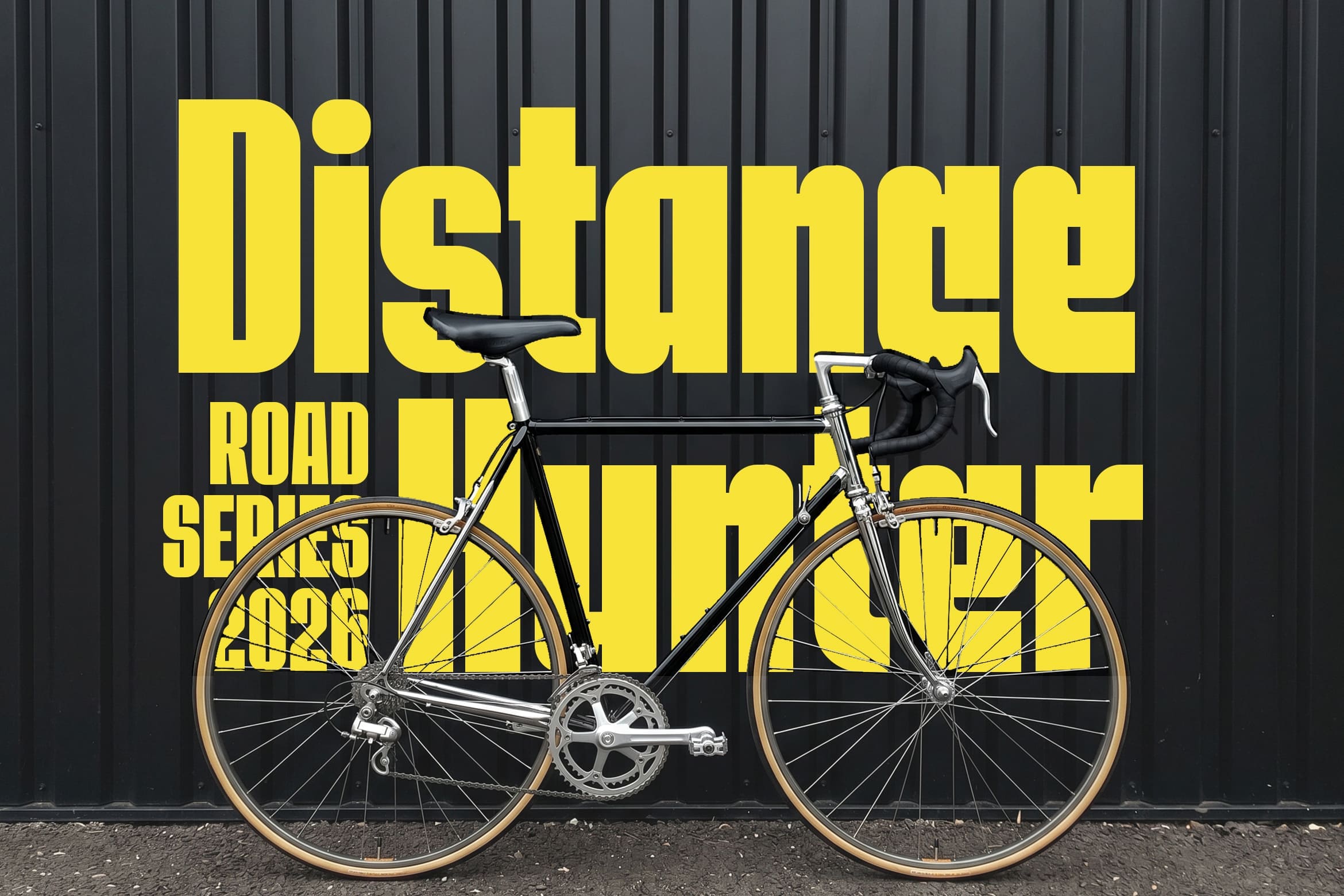 Sleek road bike positioned in front of bright yellow event poster on dark corrugated wall