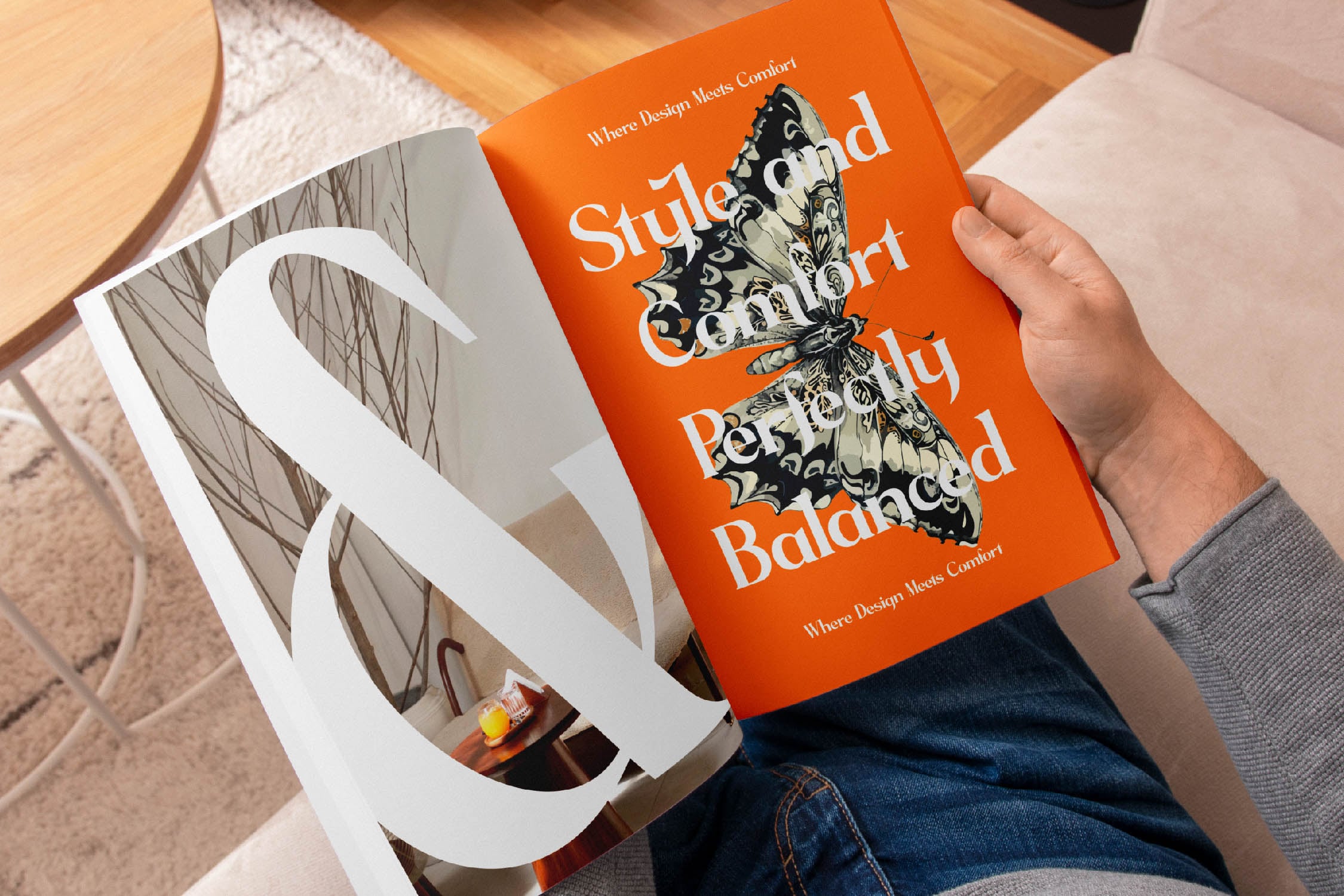 Bright orange book cover with butterfly illustration held in hands, white shopping bag visible beside it on wooden floor