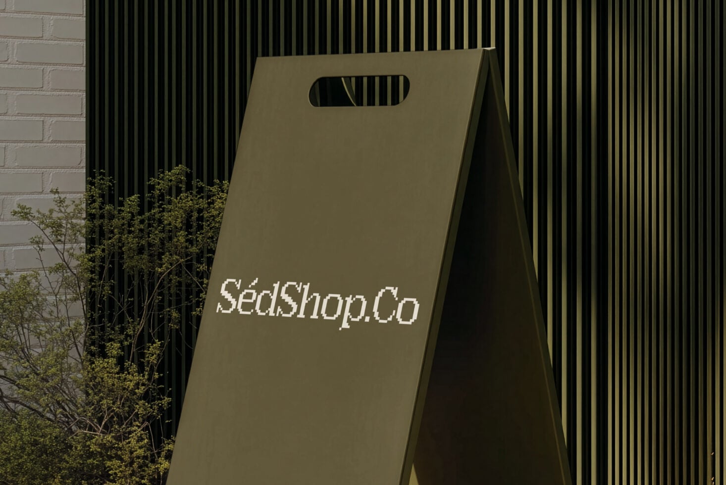 Olive shopping bag mockup leaning against striped wall with brick side