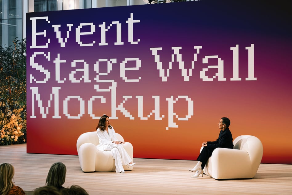 Large pixelated wall graphic with vibrant gradient backdrop for event stage setup