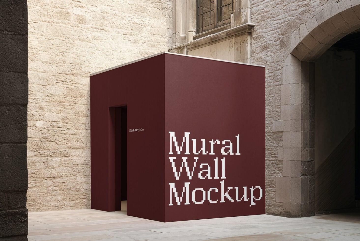 Burgundy box mockup in stone courtyard with white pixelated text on corner face