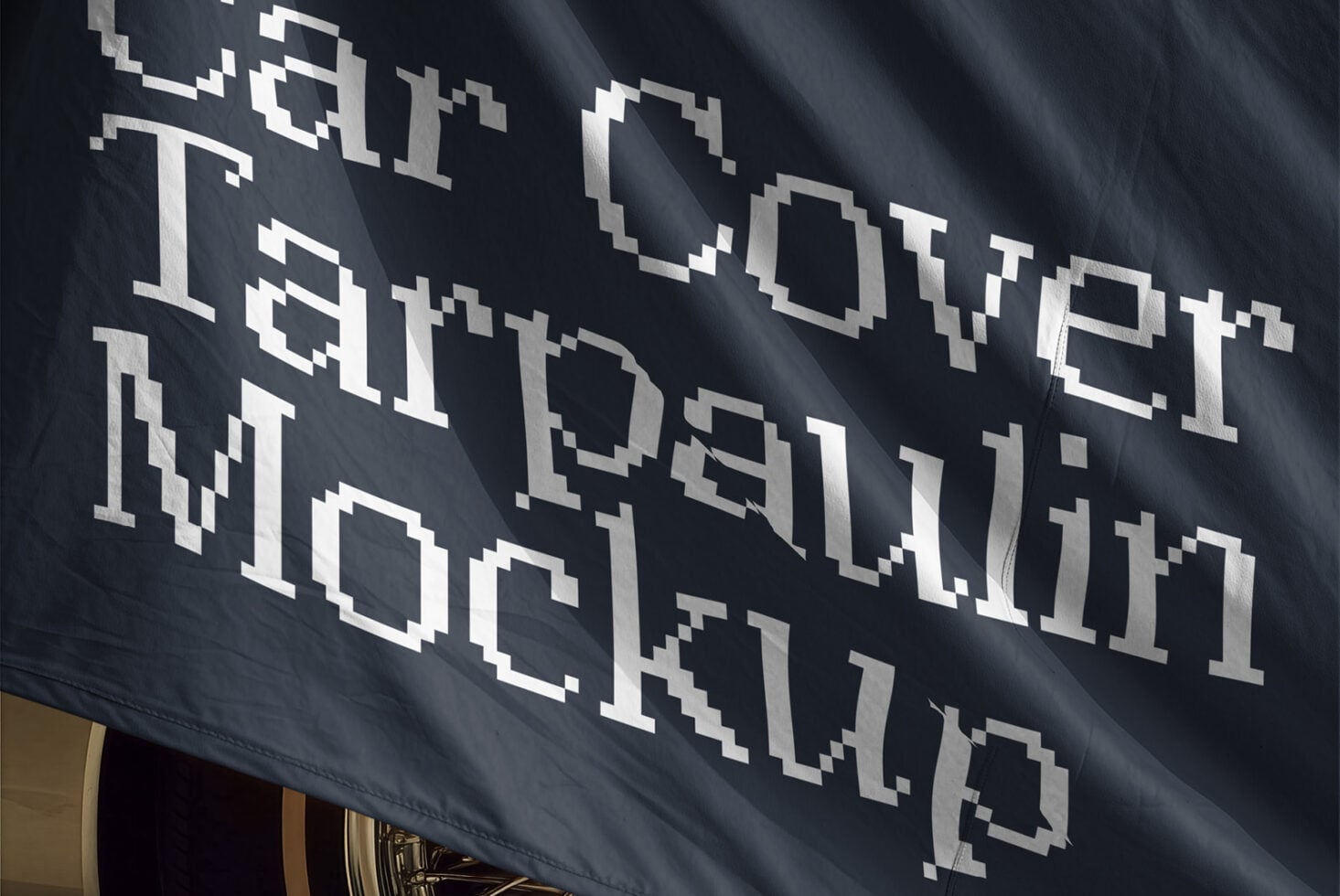 Pixelated metallic letters on dark fabric banner catching light at an angle