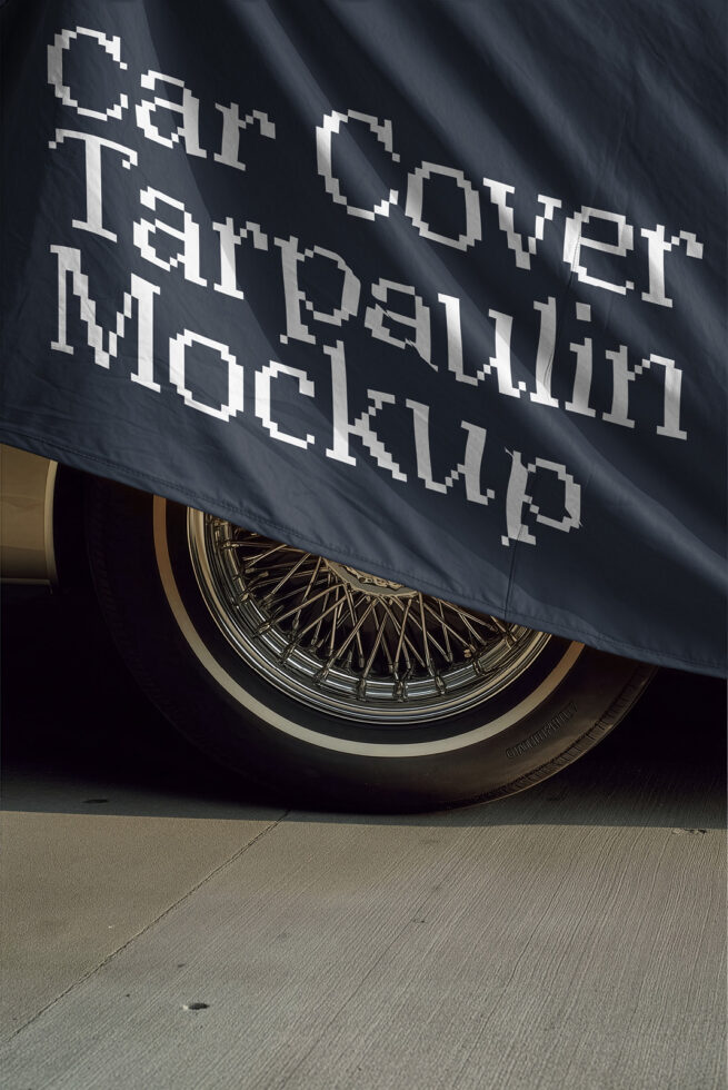 Vintage car banner mockup with chrome wheel, pixelated retro font on dark fabric