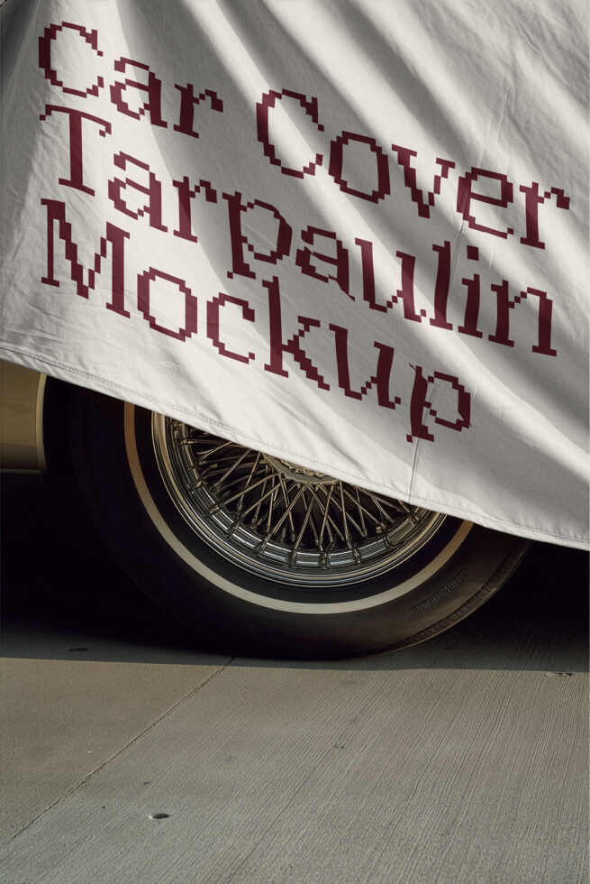 Vintage car with white fabric banner draped over wheel, burgundy pixelated text overlay