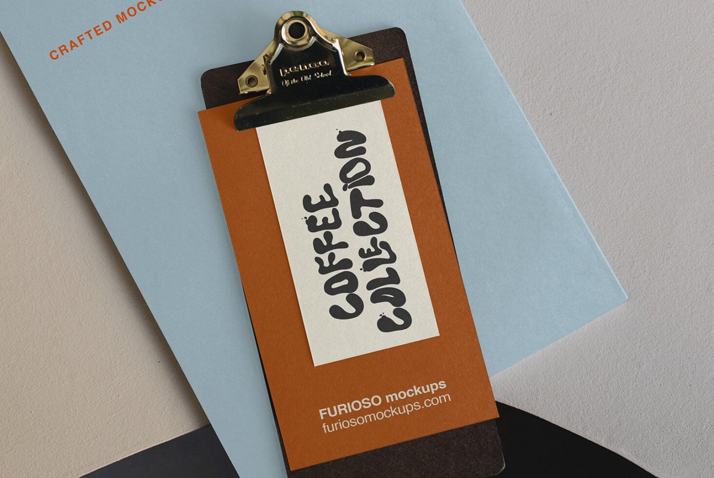 Wooden clipboard with brass clip holding cream paper displaying bold black wavy typography on blue background