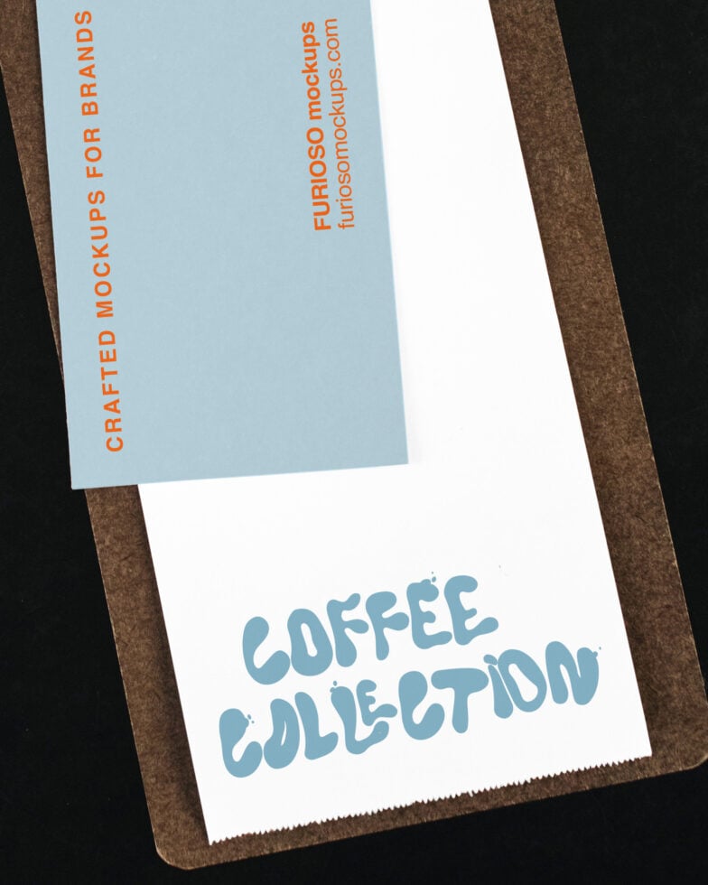 Stationery mockup with blue card showing orange text, brown clipboard backdrop