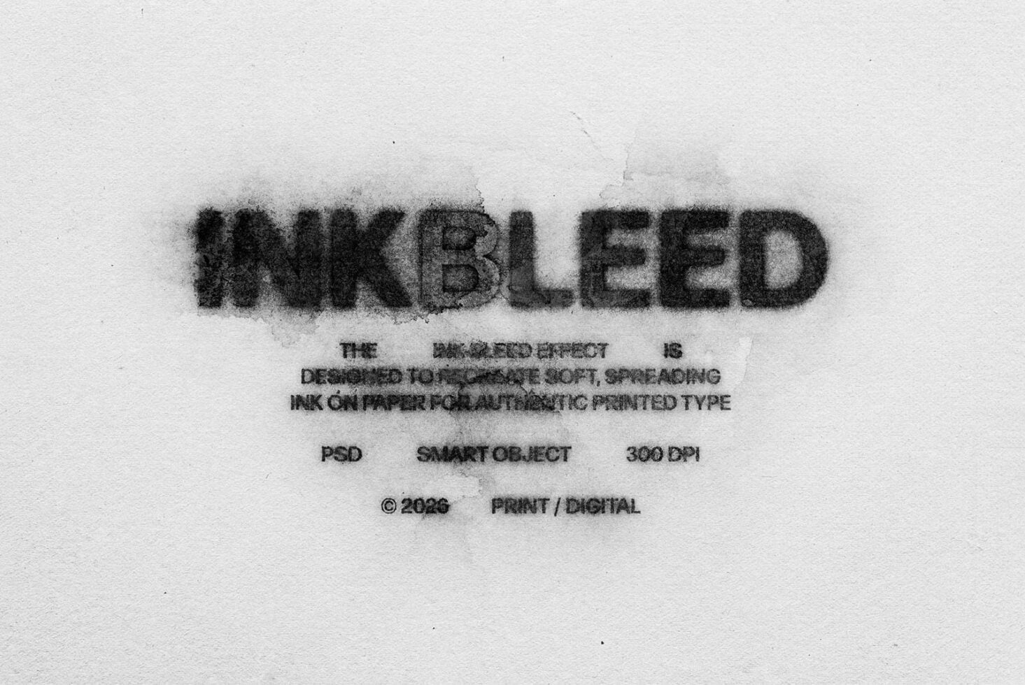 Blurred ink text effect on paper showing soft spreading letterforms in black