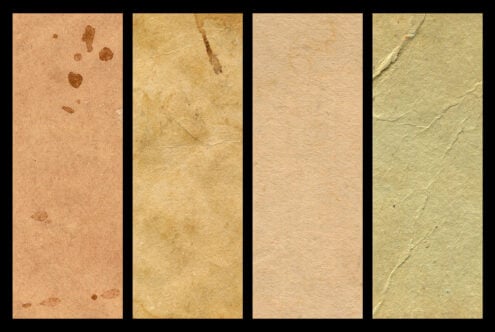 Four worn paper textures in warm earth tones with creases, stains, plus vintage vibes