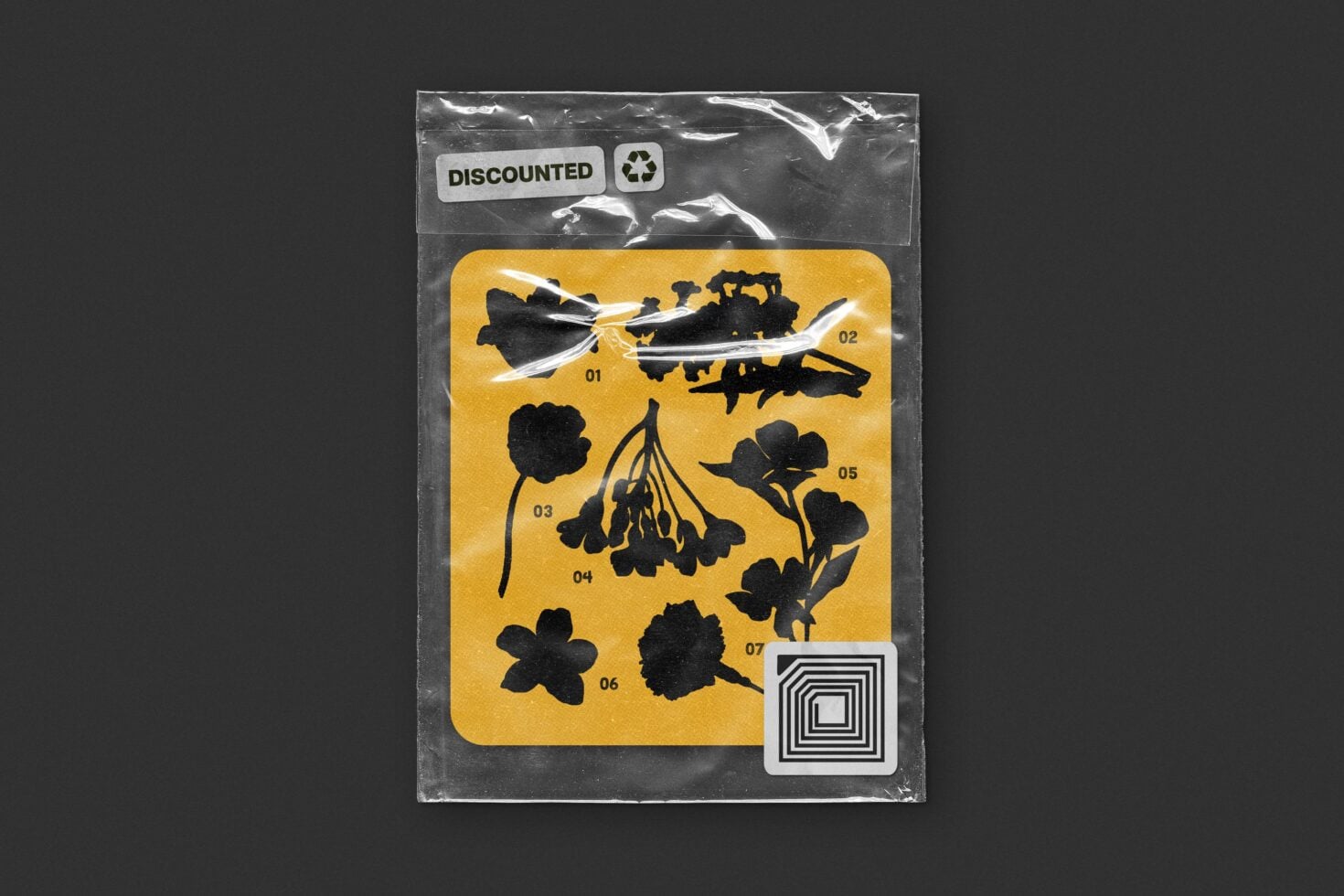 Plastic sealed package with yellow card showing seven black botanical silhouettes numbered for design use