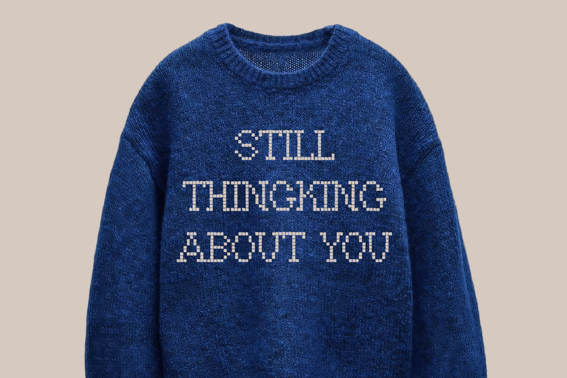 Blue knit sweater with pixelated text reading "Still Thinking About You" across chest