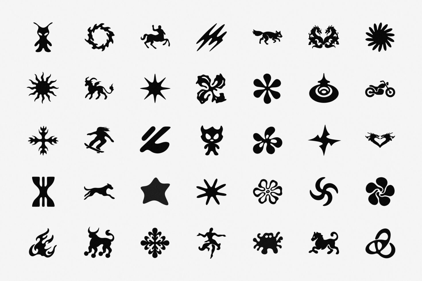 Collection of 35 bold black silhouette icons featuring animals, symbols, celestial shapes
