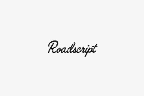 Roadscript font in distressed black script on light gray background