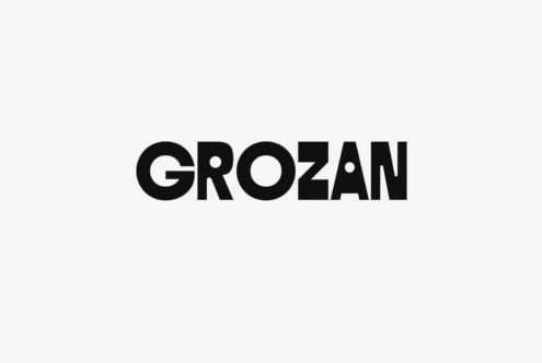 Grozan bold sans serif typeface with geometric cutouts on light background