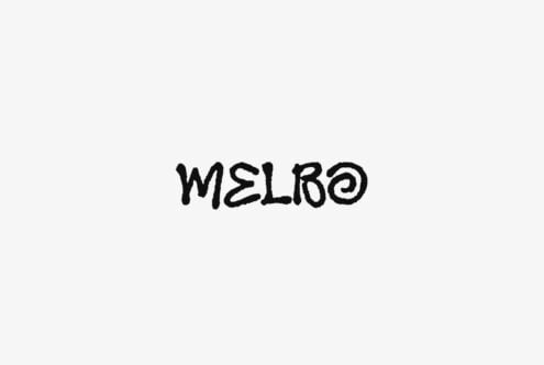 Melbo handwritten font with rough textured brush strokes on light background