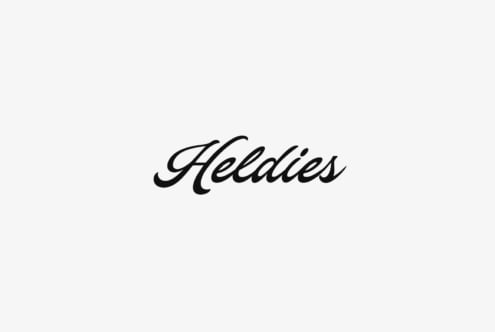 Heldies italic script font in bold black strokes on light gray background