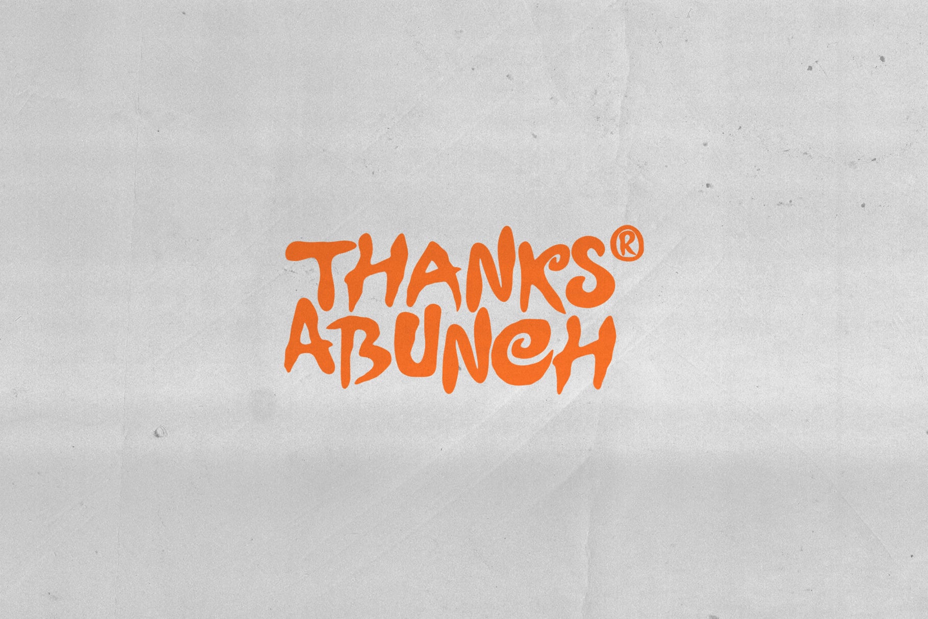 Bright orange "Thanks Brunch" hand-lettered text on concrete wall mockup