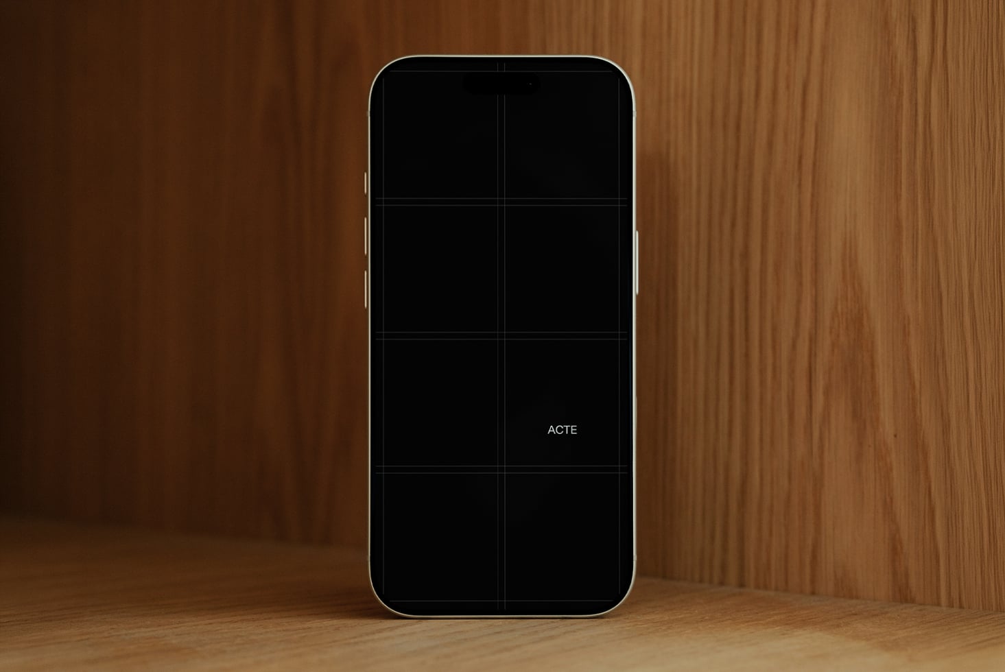 iPhone mockup with blank screen on warm wood backdrop, ready for your designs