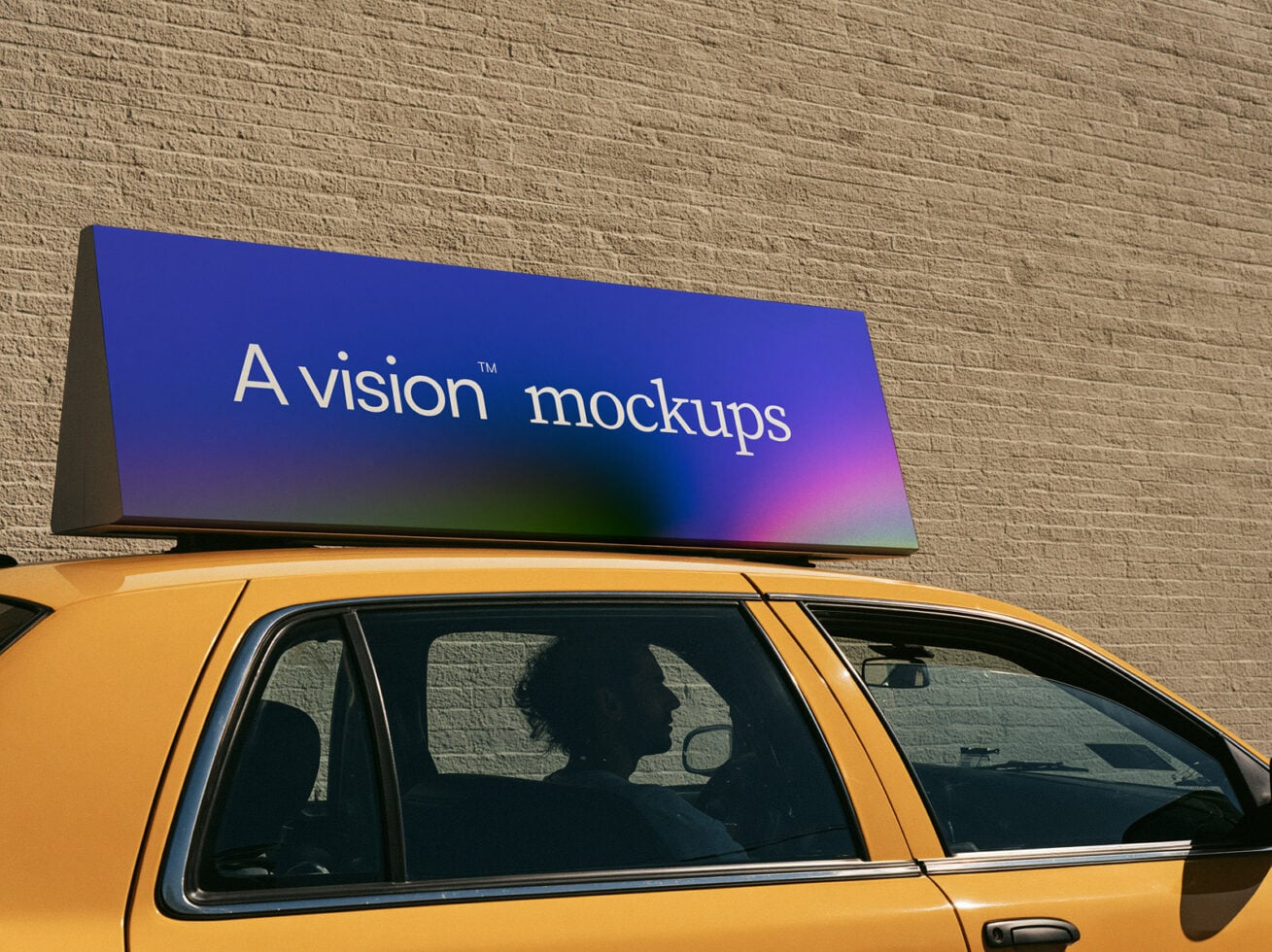 Vibrant gradient taxi roof ad mockup with blue to pink display against brick wall