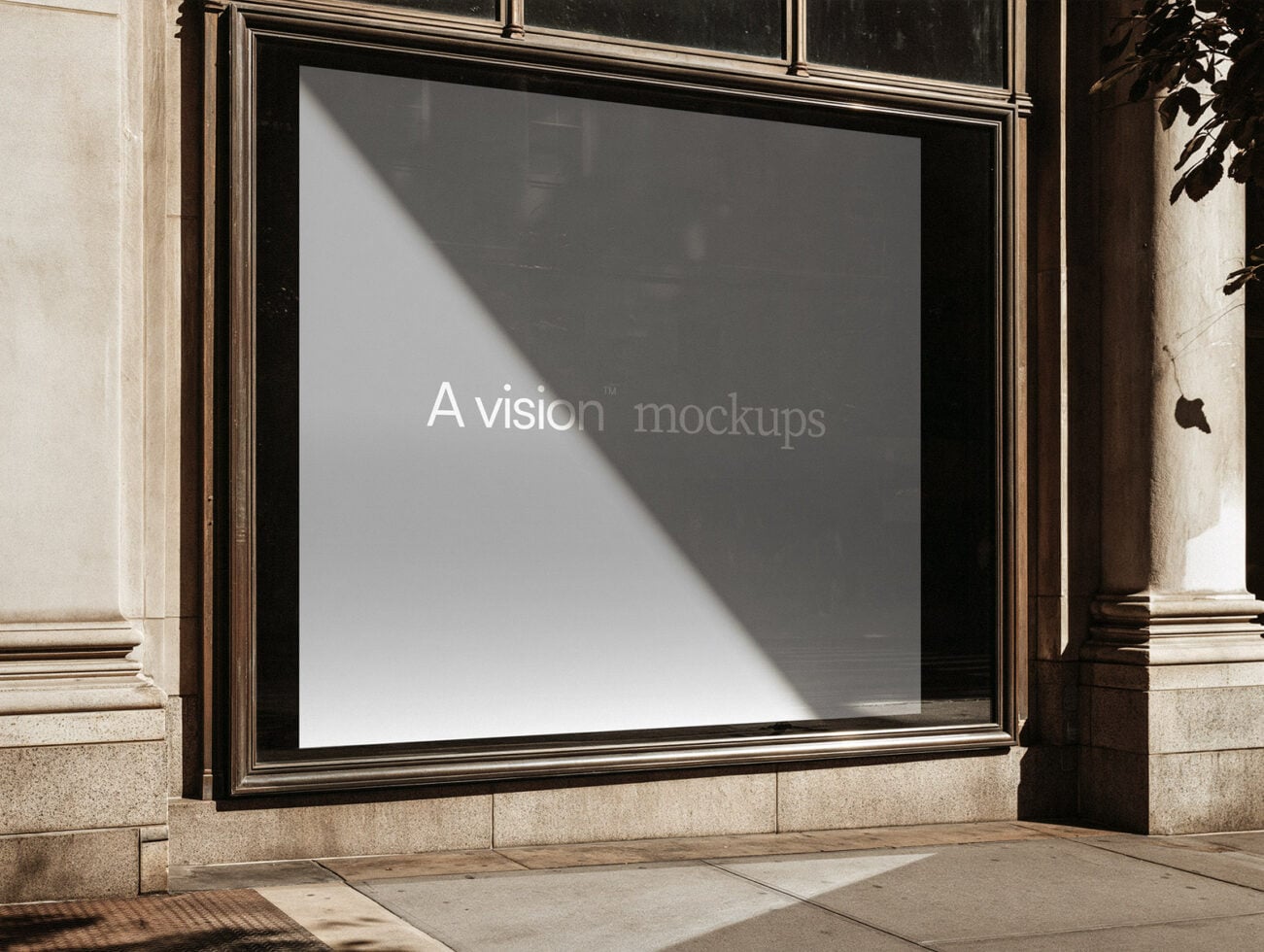 Storefront window mockup with gold frame, natural light casting diagonal shadows on blank display surface