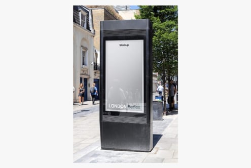 Black street advertising kiosk with white poster display on London city street